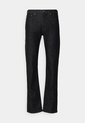 Jeans de ganga preto com corte reto, design de cinco bolsos e fecho de botão; apresentam uma textura subtil e detalhes de costura mínimos.