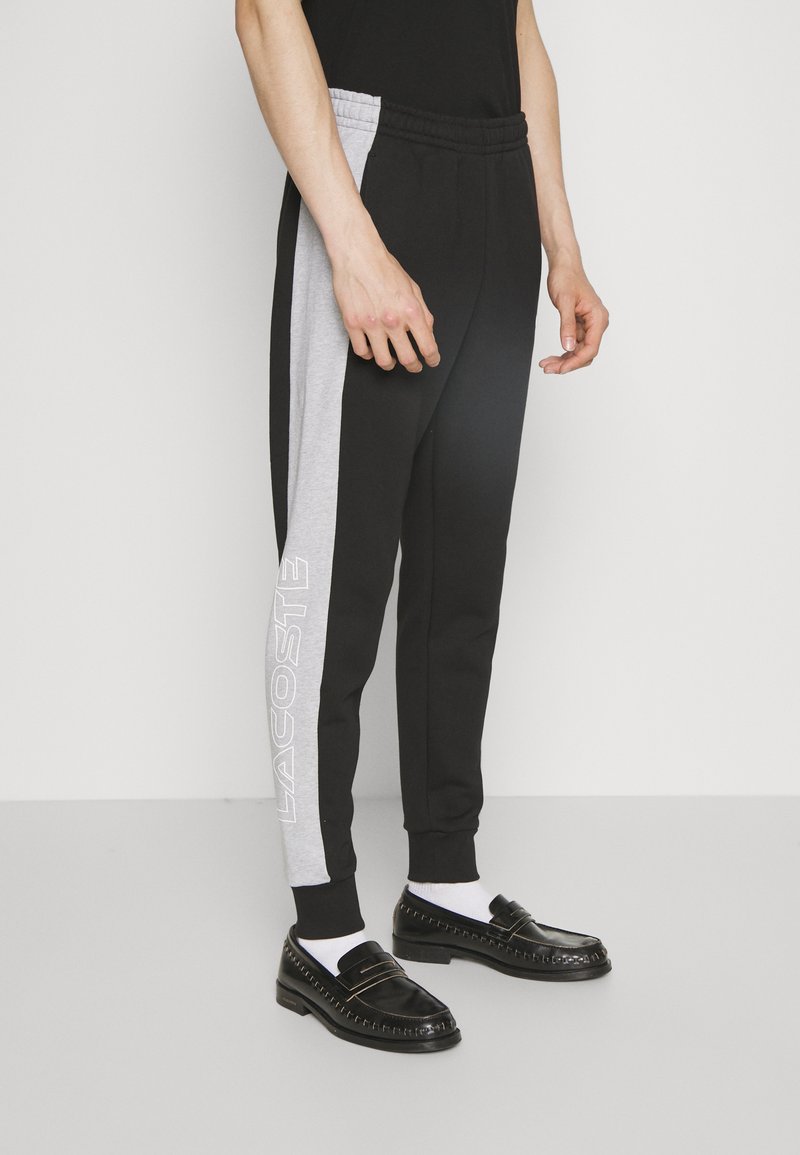 Lacoste UNISEX Tracksuit bottoms black/silver chine/black Zalando