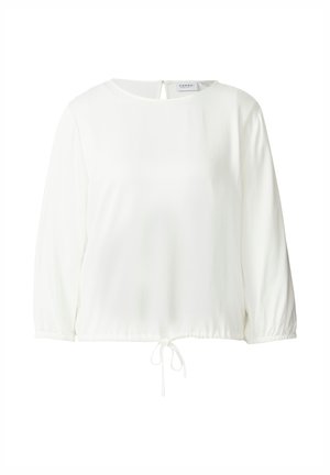 Blouse blanche à manches longues, col rond, cordon de serrage réglable à l'ourlet et une petite ouverture en forme de clé au dos. Texture de tissu lisse.