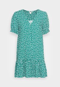 Abito corto verde a fiori con scollatura a V, chiusura frontale con bottoni e orlo arricciato. Realizzato in tessuto leggero, presenta motivi floreali bianchi sparsi.