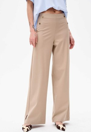 Beige wide-leg trousers with a smooth texture, featuring two decorative buttons on the waistband and side slits at the hem.