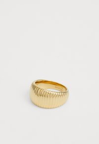 Gold-toned wide band ring with vertical ridged texture, smooth interior engraved with "GUESS 54 Stainless Steel" against white background.