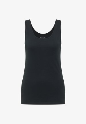 Kvinde med langt brunt hår iført en tætsiddende sort ærmeløs top og lyseblå jeans, vist bagfra på en ensfarvet baggrund.