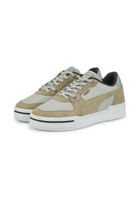Beige suede and leather sneakers with gray accents, featuring a white and black sole, round toe, and lace-up closure.