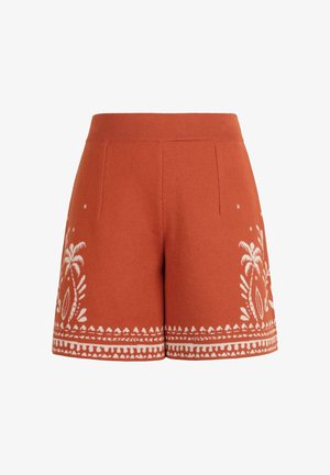 Rjave oranžne pletene kratke hlače z belimi cvetličnimi in geometrijskimi vzorci ob robu in po straneh, z oprijetim pasom in sprednjimi šivi.