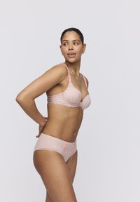 Light pink lingerie set with a checkered pattern. Bra has padded cups and floral accents on straps; brief features similar texture and detailing.