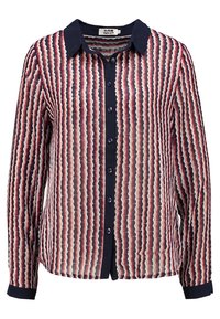 Blusa trasparente con un motivo ondulato nei colori rosso, blu navy e crema. Presenta un colletto blu navy e bottoni sulla parte anteriore. Maniche lunghe con dettagli ai polsini.
