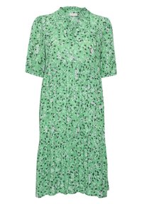 Robe verte à fleurs avec manches courtes, encolure en V, design à volants froncés et texture légère avec accents noirs et blancs.