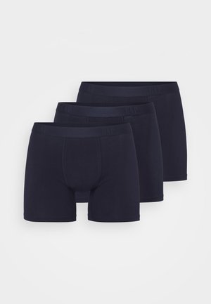 Πακέτο τριών σκούρων μπλε βαμβακερών μποξερίων με μονόχρωμο σχέδιο, ελαστική μέση με ανάγλυφο λογότυπο και κομψή εφαρμογή.