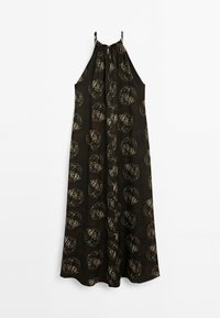 Robe longue noire sans manches avec des motifs circulaires abstraits beiges et des bretelles fines, suspendue sur un fond blanc.