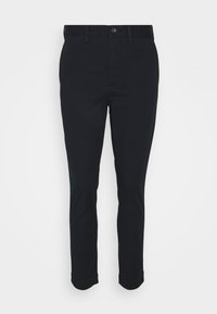 Černé bavlněné kalhoty se skinny střihem, s knoflíkovým zapínáním, poutky na opasek a ohrnutými manžetami. Hladká textilie a jednobarevný design.