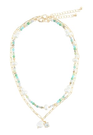 Layered gold chain necklace with small multicolored beads, irregular white pearls, a teardrop pearl charm, and a clear crystal charm.