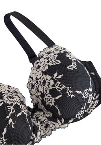 Sort bh med blonde detaljer, prydet med blomster mønstre i creme. Polstrede skåle, tekstureret stof og justerbare sorte stropper.