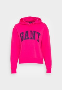 Felpa fucsia con tasca a marsupio e cappuccio con lacci. Presenta la scritta "GANT" stampata in navy sul petto. Tessuto morbido, vestibilità rilassata.