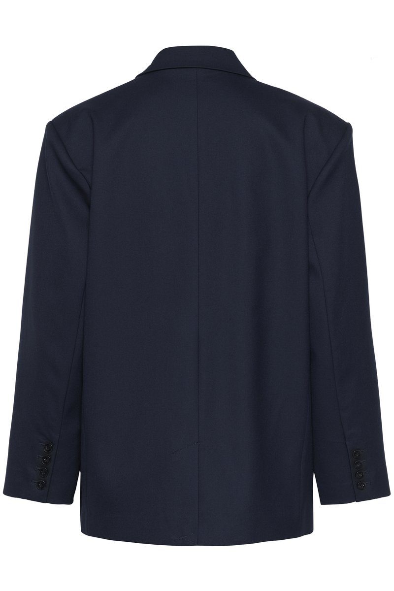 Blazer bleu marine ajusté avec manches longues, col à revers, et quatre boutons noirs sur chaque manchette, vu de dos sur fond blanc.