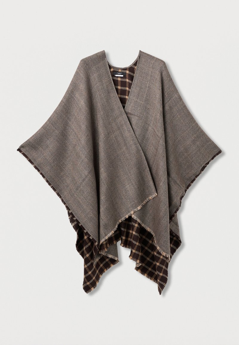 Pruun vöötkujulise mustriga ponšo narmastega äärtega, mille sisevooder on tumepruuni ja beeži ruuduline. Avatud esitüübiga.