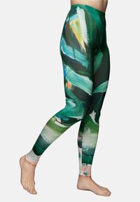 Tight-fitting leggings with a multicolored abstract pattern featuring green, blue, orange, and pink hues; made of stretchable fabric.