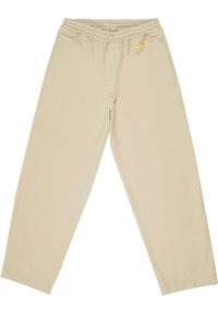 Beige Jogginghose mit elastischem Bund, seitlichen Taschen und einem Logo-Patch auf der Vorderseite. Weiches Baumwollmaterial mit großzügigem Schnitt.