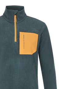 Groene gestructureerde trui met ritskraag, voorzien van een contrasterende gele borstzak. De zak heeft een reliëfopdruk van het merk voor een extra detail.