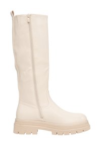 Beige leren laars tot net onder de knie met een zijrits, een gestructureerde rubbere zool en een afgeronde neus. Voorzien van subtiele stikdetails als accent.