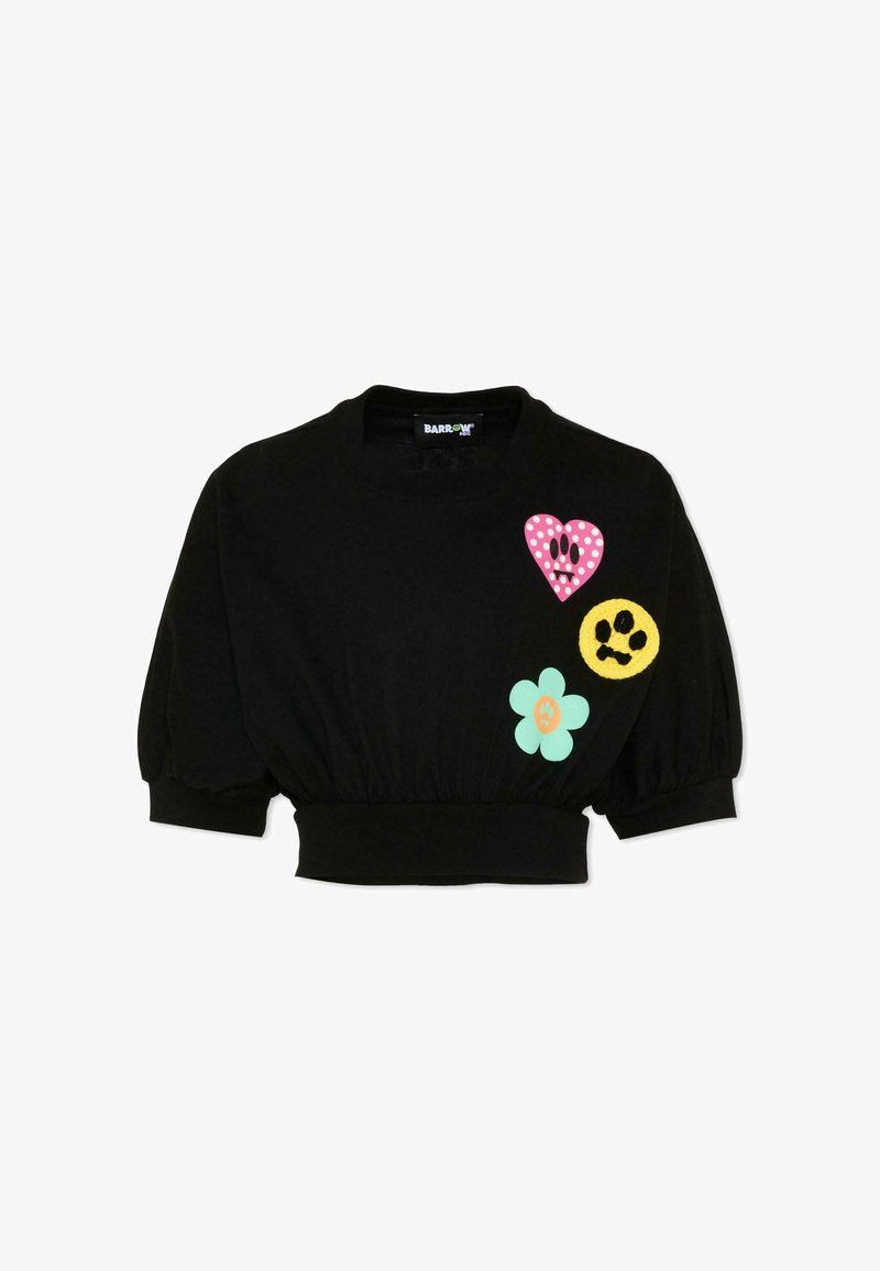 Sweat-shirt noir court avec manches bouffantes, orné sur le devant d'un cœur à pois roses, d'un visage souriant jaune et de patchs de fleurs vert menthe.