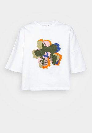 White short-sleeve t-shirt featuring a textured multi-colored floral design in green, orange, pink, blue, and light brown at the center.