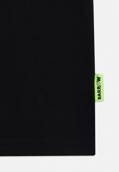 Black cotton t-shirt featuring a visible green label with "BARROW" text, fine stitching at the hem, smooth texture, minimalist design.