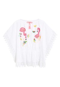 Weiße Baumwollbluse mit pinkem Flamingo-Stickerei, floralen Akzenten und einer Spitzenkante. Mit Rundhalsausschnitt und Quasten-Detail.