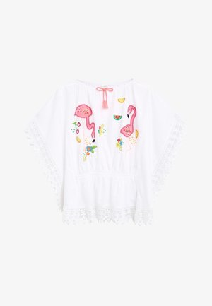 Biały bawełniany top z różowymi haftowanymi flamingami i kolorowymi wzorami owoców. Posiada koronkową lamówkę oraz wiązanie na szyi z frędzlami.