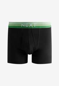 Boxer shorts en coton noir avec une ceinture élastique rayée verte et blanche portant le logo "NEXT" en blanc. Coupe standard sans motifs visibles.