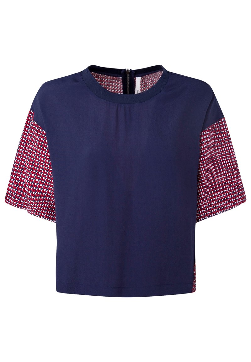 Navy crop top with short patterned sleeves featuring red and white geometric designs, round neckline, and a back zipper.