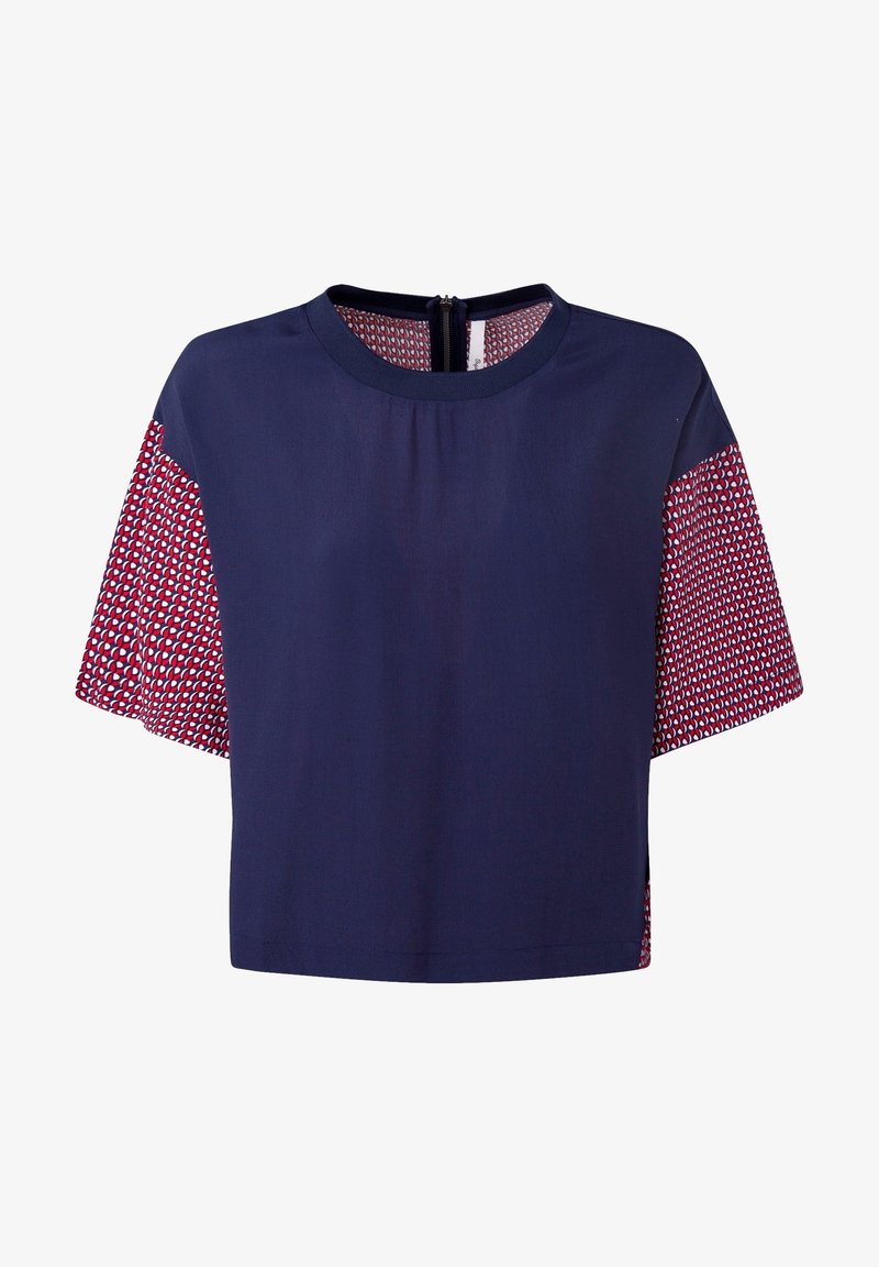 Navy crop top with short patterned sleeves featuring red and white geometric designs, round neckline, and a back zipper.