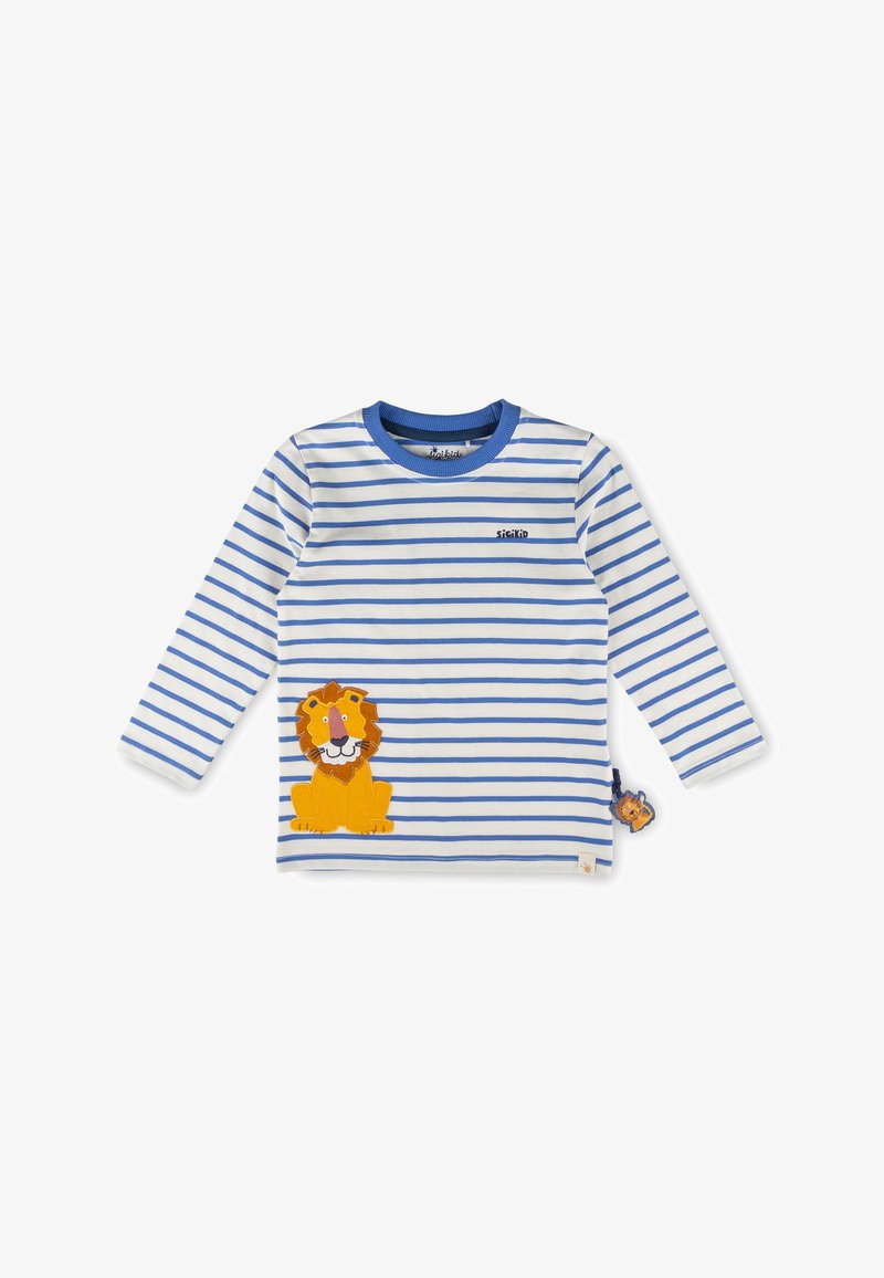 Chemise blanche à manches longues avec des rayures bleues, un col bleu et un patch lion cartoon jaune sur le côté avant gauche.
