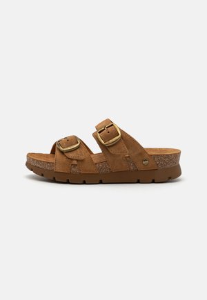 Brown suede sandals with two adjustable buckles. Features a textured cork footbed and a thick rubber sole for support.