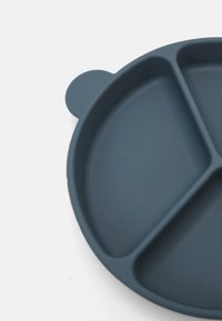 Divided plate made of dark blue silicone. Features three sections with a smooth texture and a small handle for easy grip.