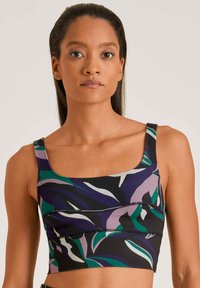 Multicolor cropped tanktop met een bloemenpatroon in paars, groen en zwart. Gemaakt van rekbare stof met een vierkante halslijn en dikke schouderbanden.