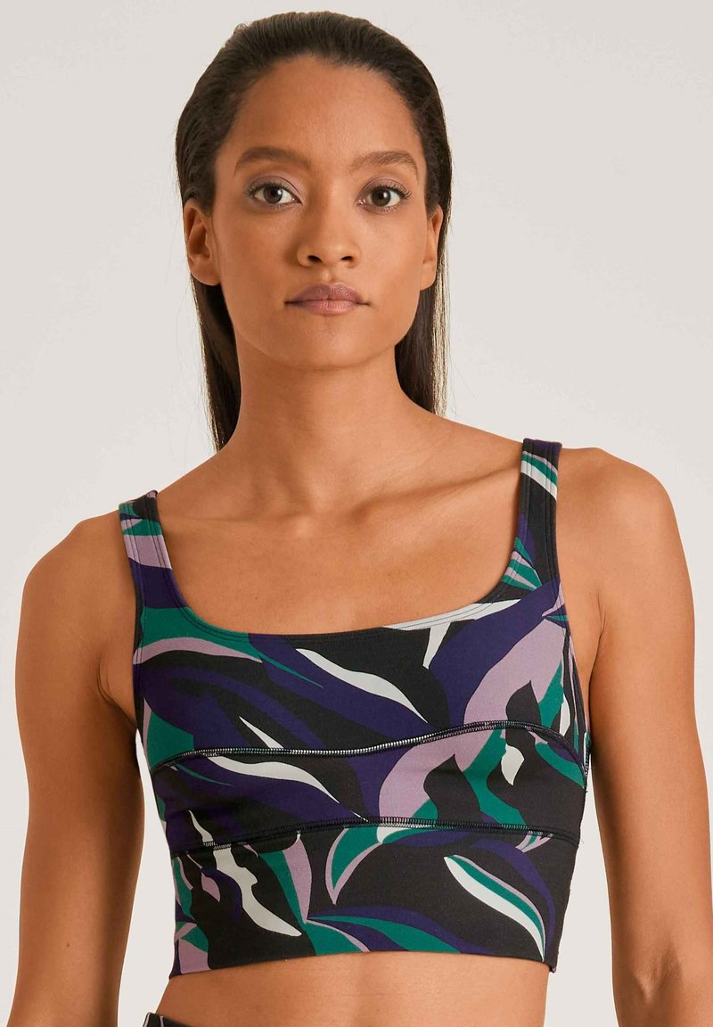Multicolor cropped tanktop met een bloemenpatroon in paars, groen en zwart. Gemaakt van rekbare stof met een vierkante halslijn en dikke schouderbanden.