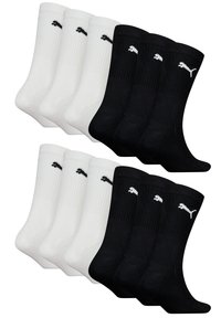 Sechs Paar gerippte Socken in Weiß und Schwarz, mit einem kleinen gestickten Logo. Baumwollmischung, knöchellang mit glatter Textur.