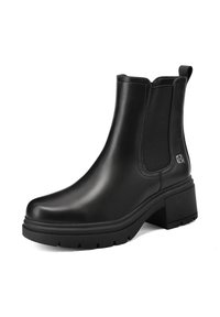 Botín negro de cuero liso con paneles laterales elásticos y una lengüeta en la parte trasera. Presenta un tacón grueso y una suela de goma texturizada.