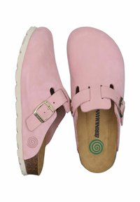 Zoccoli in pelle rosa con cinturino regolabile, design aperto e soletta testurizzata. Suola in gomma bianca con motivo a onde.