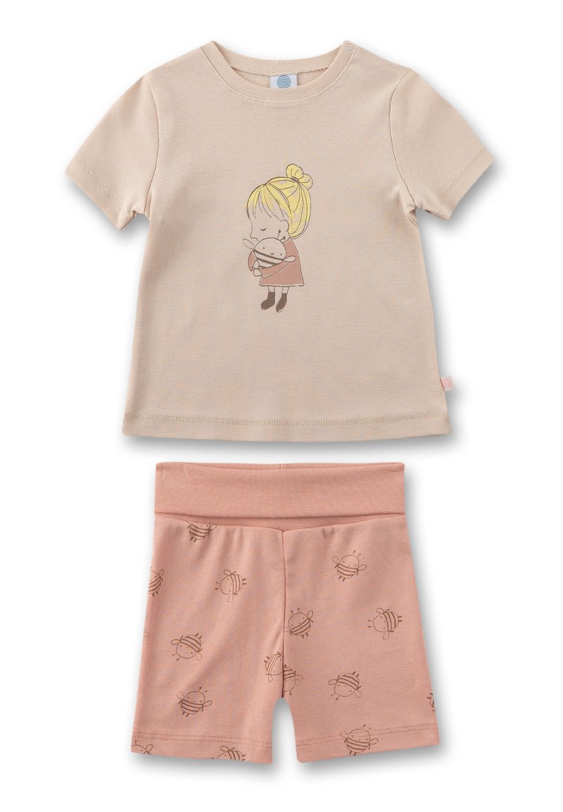 Beige Baumwoll-T-Shirt mit einem Druck eines Cartoon-Charakters, kombiniert mit pinken Shorts mit einem Bienenmuster. Weiches, leichtes Material mit einem lässigen Schnitt.