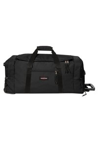 Sac de sport noir en tissu durable, avec deux poignées supérieures, des compartiments zippés et une poignée rétractable pour un transport facile.