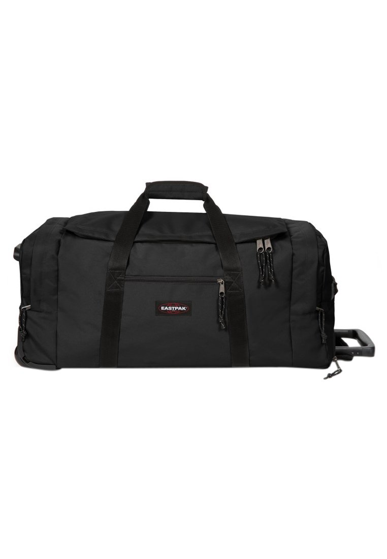 Sac de sport noir en tissu durable, avec deux poignées supérieures, des compartiments zippés et une poignée rétractable pour un transport facile.