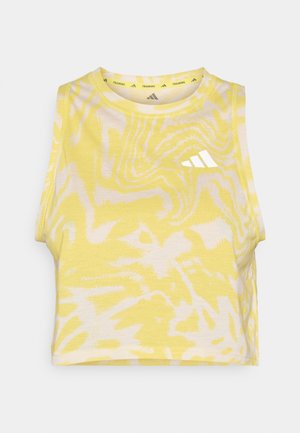Yellow sleeveless crop top with abstract white pattern, round neckline, and subtle logo detail in white on the front. Soft fabric texture.