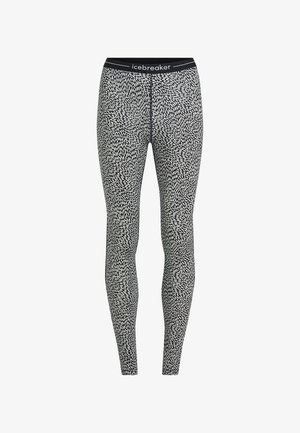 Tights tillverkade av ett stretchigt, lättviktigt tyg med ett svartvitt abstrakt mönster och en svart midjeresår med texten "icebreaker".
