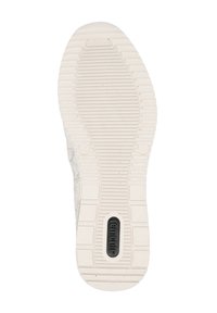 Semelle de chaussure en caoutchouc avec un motif texturé et rainuré. La couleur est crème clair avec un détail de logo noir près du centre.