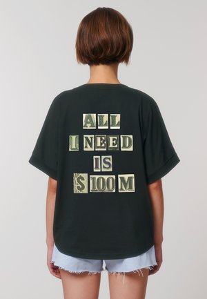 Black oversized t-shirt with short sleeves featuring white and green text reading "ALL I NEED IS $100M" in varying styles.
