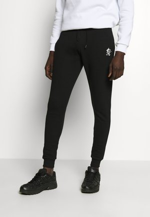 BASIS - Tracksuit bottoms - black