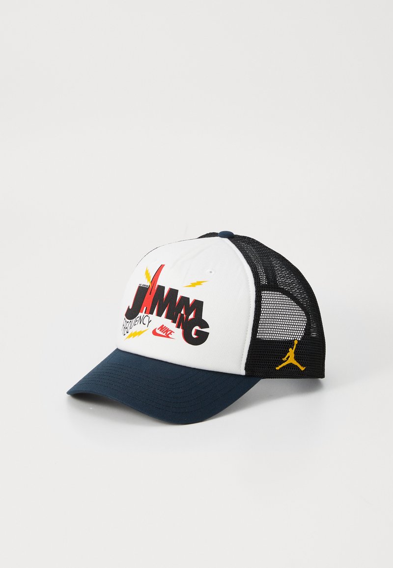 Trucker cap with a white front, black mesh sides, and a navy blue brim. Features colorful graphics and a Jumpman logo on the side.