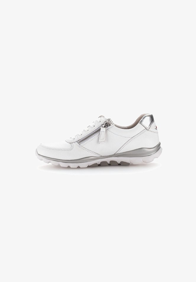White leather sneaker with silver accents, a side zipper, textured sole, rounded toe, and cushioned interior for comfort.